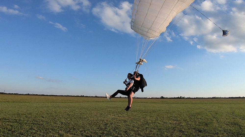 Tandem skydiving landing